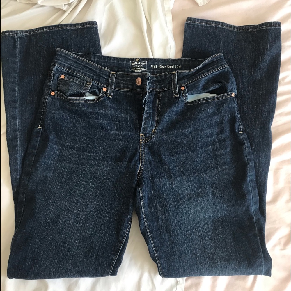 Levi’s mid-rise boot cut medium wash jeans size 10